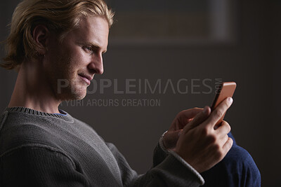 Buy stock photo Night, reading or man with phone in house, browsing social media or connectivity for internet video. Smile, ebook or person with mobile for evening texting, web chat or forum for message notification