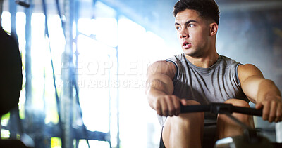 Buy stock photo Fitness, man and rowing machine in gym, cardio workout and resilience training for strength challenge. Sports club, equipment and athlete with endurance exercise for health, commitment or muscle gain