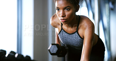 Buy stock photo Fitness, serious or woman in center with dumbbell, weightlifting power or renegade row in bodybuilding. Exercise, sweating or African person with equipment, intense workout or strength in muscle gain