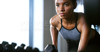 Buy stock photo Fitness, serious or woman in gym with dumbbell, weightlifting power or renegade row in bodybuilding. Exercise, sweating or African person with space, intense workout or strength in muscle development