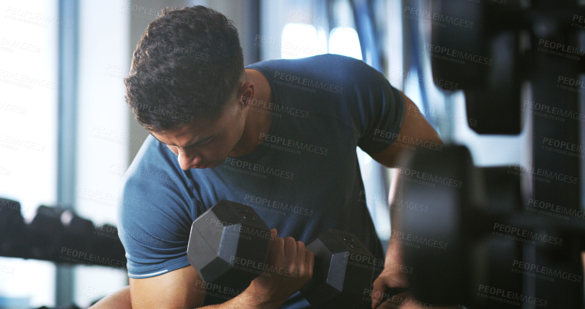 Buy stock photo Man, fitness and weightlifting with dumbbell in gym for muscle gain, workout or indoor exercise. Active, male person or lifting with weight or arm for bicep curl or strength training in health club