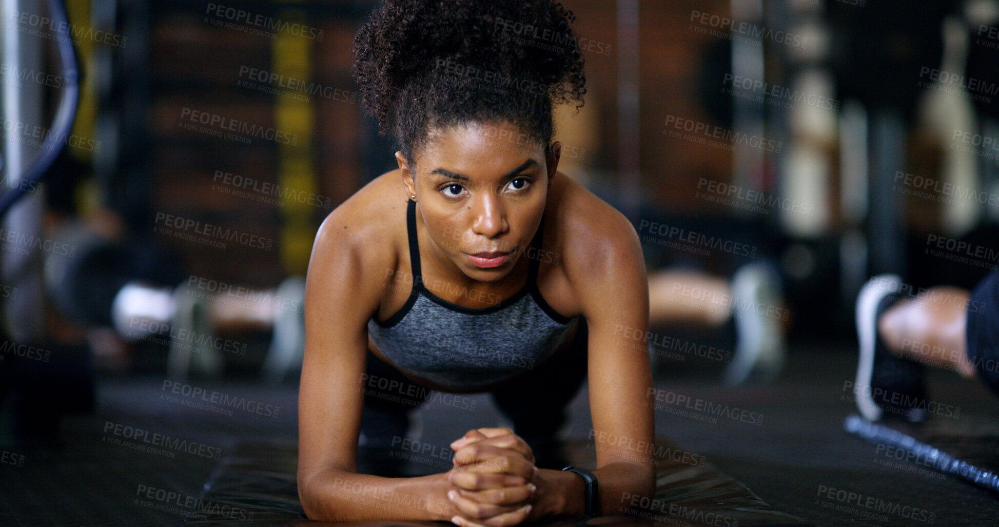 Buy stock photo Woman, fitness and plank in gym with workout, endurance and training for wellness in health club. Serious, female person and balance on floor with stability, strength challenge and exercise for abs.