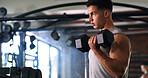 Dumbbell, fitness and breathing with man in gym for strength training or workout routine. Intense, exercise and weightlifting with bodybuilder in health club for physical challenge or resilience