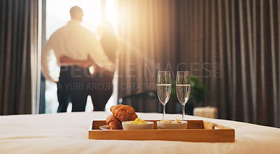 Buy stock photo Champagne, breakfast and couple in hotel with room service for anniversary holiday, getaway or vacation. Curtains, sparkling wine and back of people by window for view with morning meal on trip.