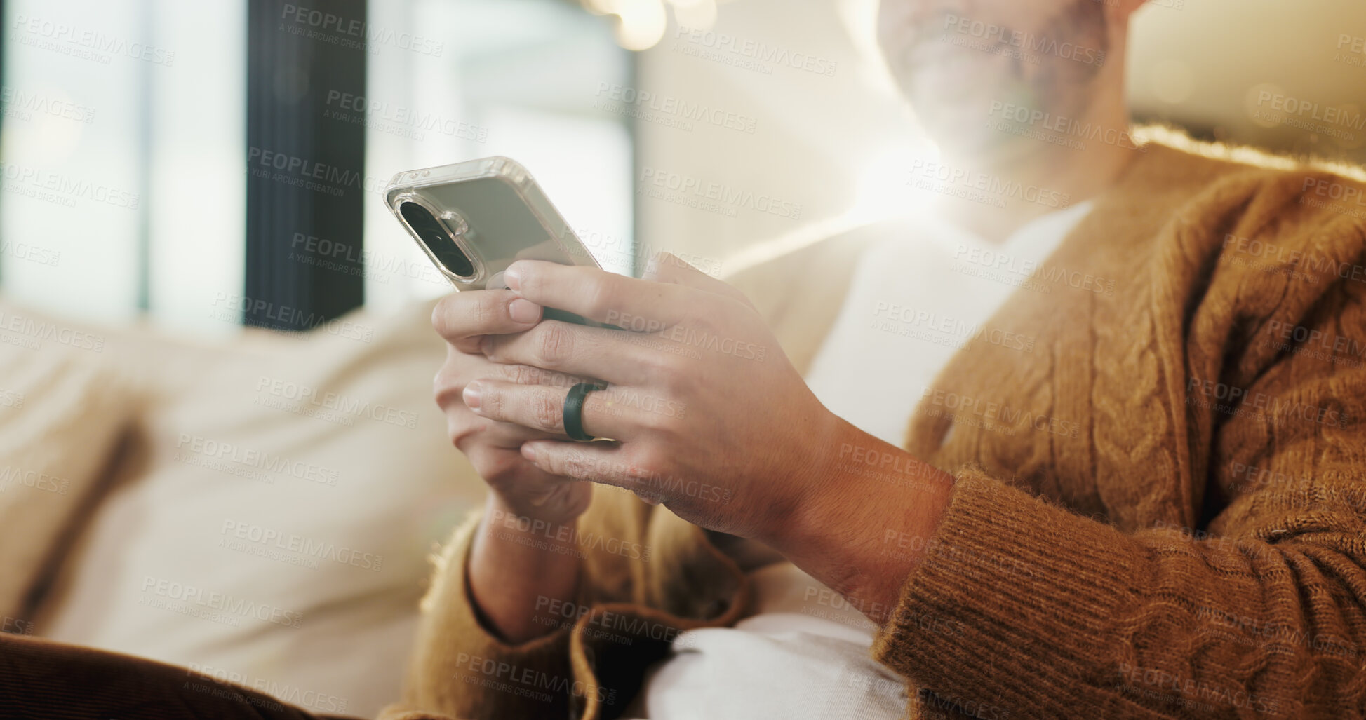 Buy stock photo Phone, hands and man in home for text message, online dating and social media notification on sofa. App, mobile and person at living room for communication, matching and check profile on internet