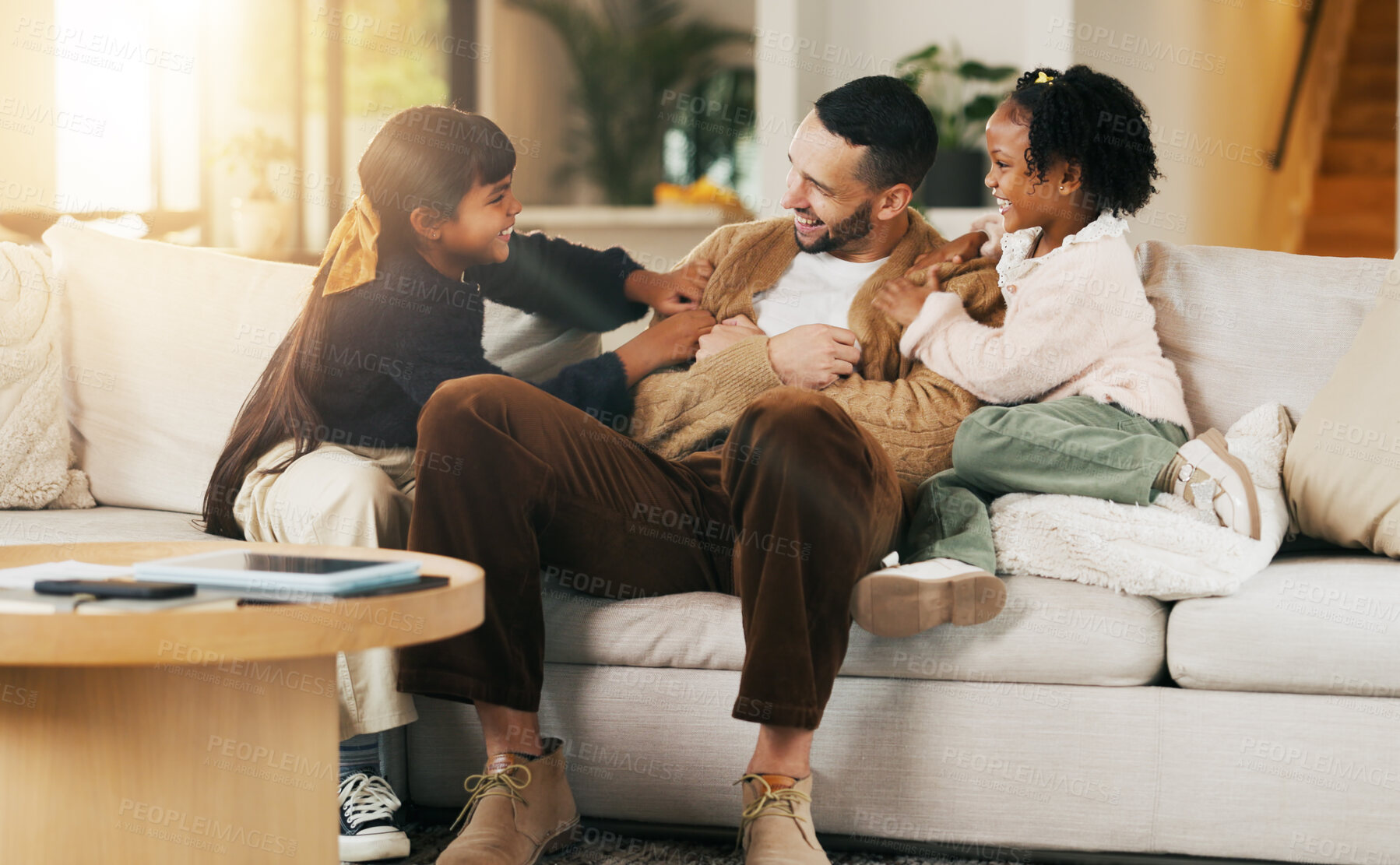 Buy stock photo Happy, children and tickle dad on sofa for bonding together, playful relationship and laughing. Love, kids and playing with father in living room for funny weekend break, support and security in home