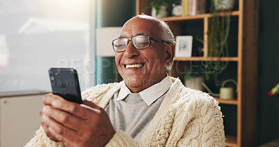 Buy stock photo Smile, phone and senior man in home for email notification, text message or news update in retirement. Mobile, elderly person and reading article for online story, newsletter app and browsing website