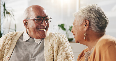 Buy stock photo Old couple, love and relax with smile in house, retirement and laugh with partner on weekend or chat. Elderly people, bonding and comfortable with spouse, happy and funny conversation in living room