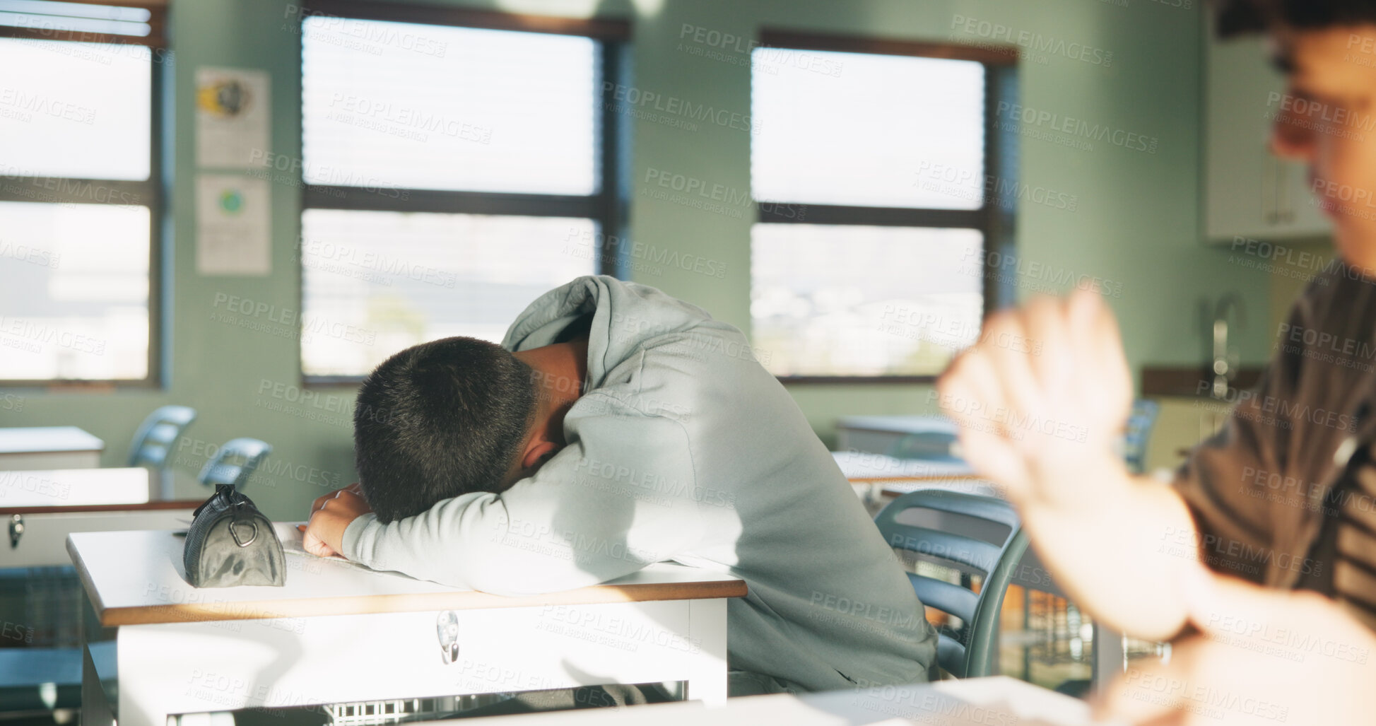 Buy stock photo School, tired and student sleeping in classroom bored from lesson, learning and studying at desk. People, college and teen boy with fatigue, burnout or exhausted nap for test, exam or education