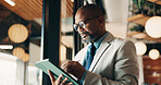 Businessman, glasses and research with tablet in cafe, private wealth attorney and will draft on web. Black person, estate planning and mature lawyer with tech for project or remote work in office