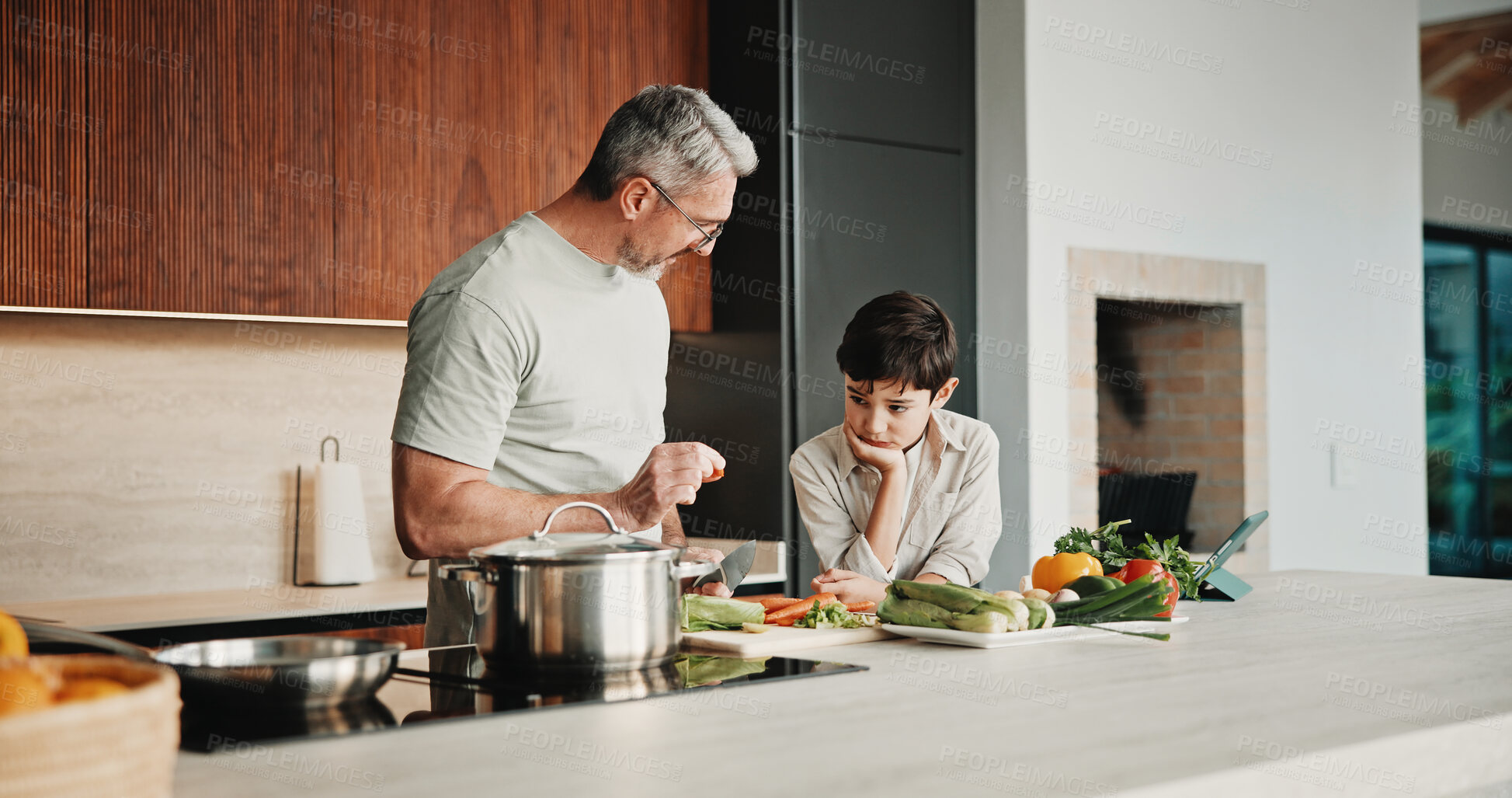 Buy stock photo Father, child and teaching with cooking, skills and meal prep in home for education. Dad, kid and learning recipe for development, growth or bonding in kitchen with support and ingredients for dinner