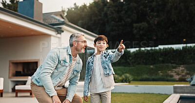 Buy stock photo Pointing, talking and son outdoor with father for curious, growth or development in garden. Gesture, imagine and smile of boy child in home backyard with single parent man for interest or question