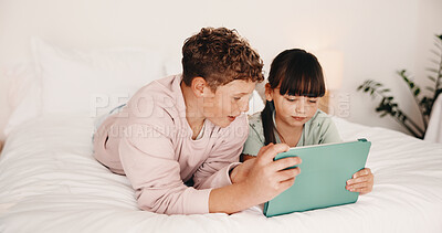 Buy stock photo Children, bed and watching with tablet in home for entertainment or online subscription together. Boy, girl or siblings relax with technology, app or network in bedroom for movie, show or cartoon