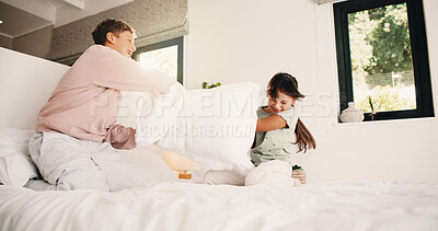 Buy stock photo Happy, children and fight with pillow in bedroom for fun, playful interaction and friendly battle. Smile, siblings and playing with cushion, morning activity and funny games for weekend break in home