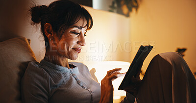 Buy stock photo Woman, online and happy with tablet in bedroom, entertainment and watching movies on streaming site. Scroll, film and mature person with tech at night, app subscription and search website in house