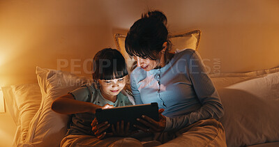 Buy stock photo Night, mother and child in bed with tablet, reading ebook and bedtime story for bonding together. Evening, mom and daughter relax in home with tech, literature or kids storytelling app for fairytale.