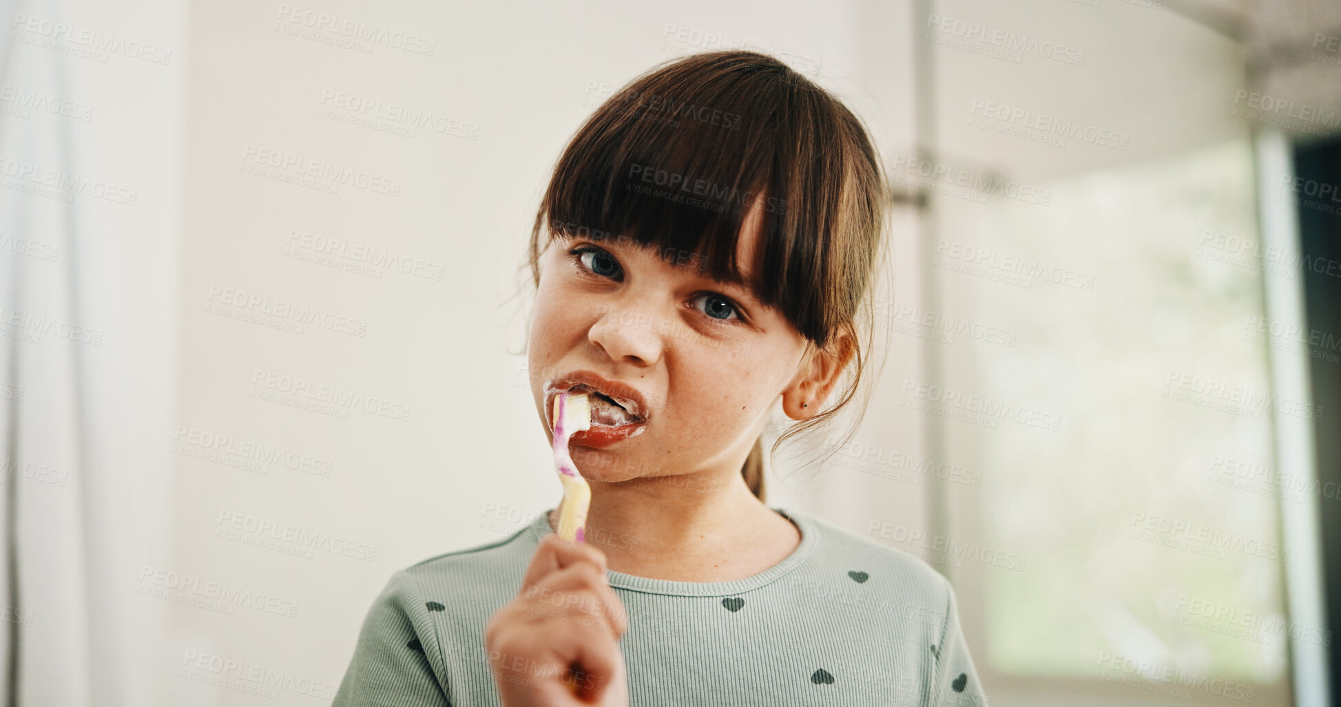 Buy stock photo Toothbrush, oral health and portrait of child in bathroom for development, growth or hygiene in home. Toothpaste, wellness and girl kid brushing teeth in morning for fresh breath and dental care.