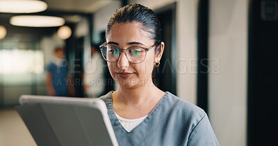 Buy stock photo Healthcare, nurse and woman with tablet in clinic, reading report or update records for insurance. Tech, telehealth and person in hospital for research, medical history and review schedule for admin