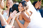 Beautiful stylish bride greeting and socialising with friends and family. Guests congratulating the bride on her wedding day