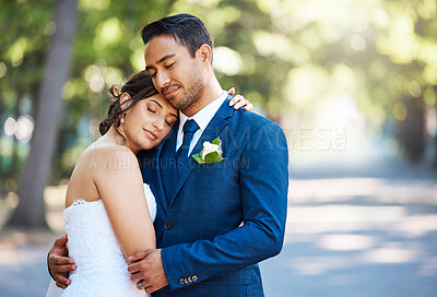 Buy stock photo Love, couple and hug at wedding at park for celebration event, commitment or eternal union. People, bride or groom with embrace at marriage ceremony in nature for partnership, loyalty or relationship