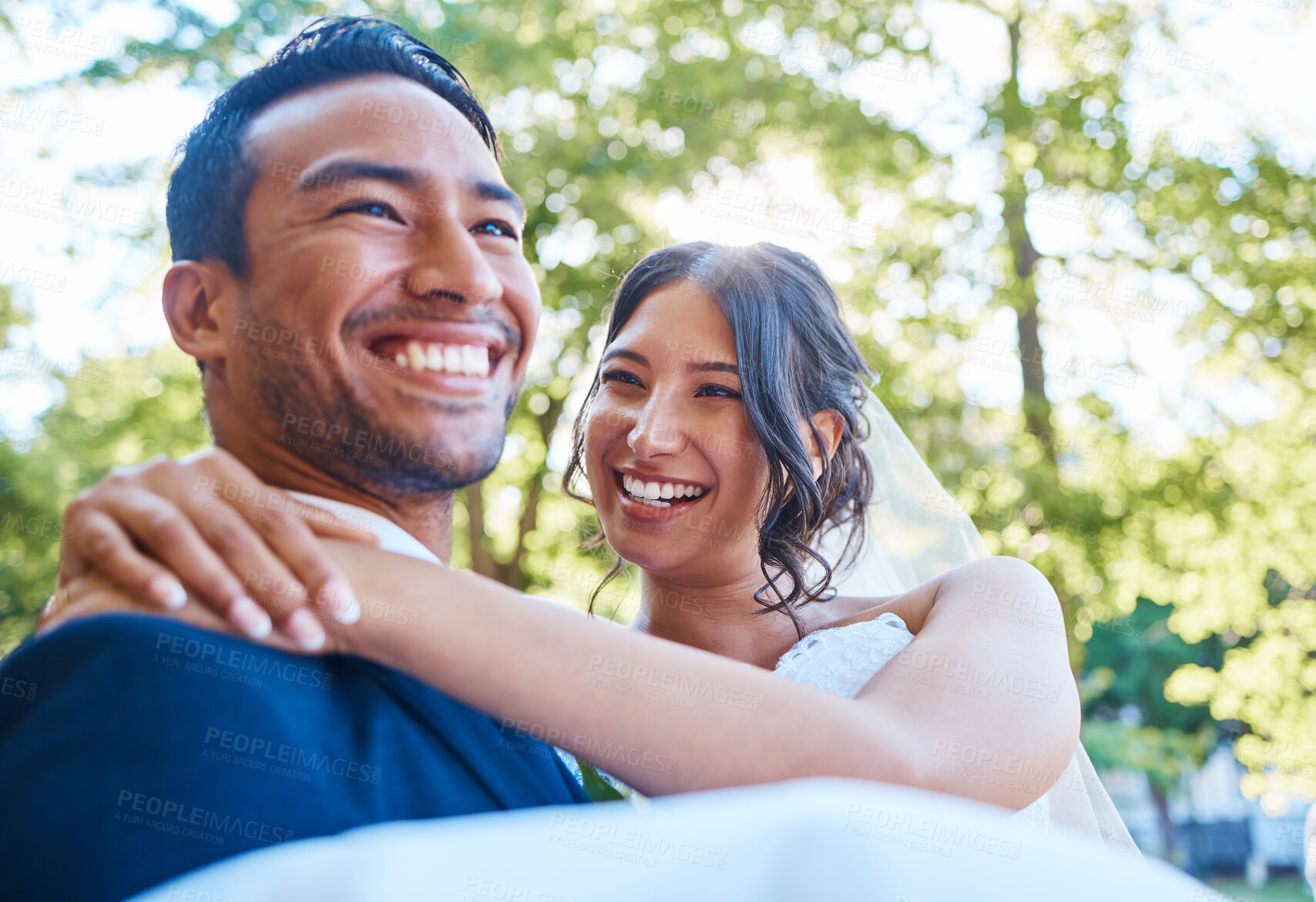 Buy stock photo Carry, smile and couple at wedding outdoor for marriage, love or trust in nature. Bride, groom and people with affection, partner and support for connection, romantic and happiness together in park 