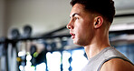 Thinking, sweating or man with fitness in gym, workout fatigue or planning routine on training break. Reflection, tired or athlete with exercise pause in sports club, serious or practice decision