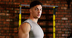 Break, portrait or man in gym for fitness, workout fatigue or progress in physical exercise. Serious, sweat or athlete in center with confidence, training recovery or reflection on body improvement.