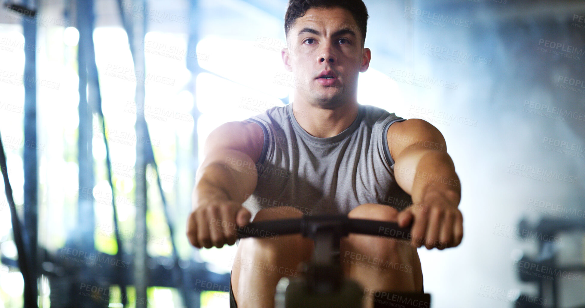 Buy stock photo Fitness, workout or man in gym with rower, power or strength exercise for body improvement. Flare, core endurance or athlete with machine, intense training or challenge for muscle development.