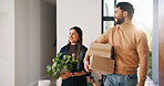 New home, happy and couple with boxes for moving, property investment and relocation. Real estate, marriage and man with woman with package, plant and excited for mortgage, dream house and purchase