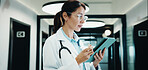 Reading, doctor and woman with tablet in clinic, medical journal and healthcare protocol revision. Review, research or mature physician with ebook on clinical diagnosis, tech or policy update info