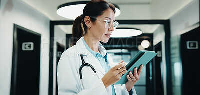 Buy stock photo Reading, doctor and woman with tablet in clinic, medical journal and healthcare protocol revision. Review, research or mature physician with ebook on clinical information, tech or policy update
