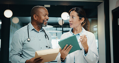 Buy stock photo Discussion, meeting or doctors with tablet in hospital, care plan assistance or medical case advice. Smile, tech or mature people with specialist referral for treatment, patient diagnosis or teamwork