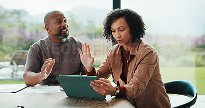 Buy stock photo Finance, argue and couple with tablet in home, savings account withdrawal and reading bank balance. Conflict, mature and African people with tech for transaction history, money dispute and debt bills