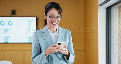 Buy stock photo Business, woman or happy with phone in office for economic data, monitor market or earnings report. Financial analyst, mature person and smile with mobile app for KPI metrics, finance news and review