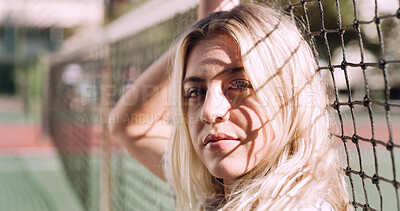 Buy stock photo Serious, relax and portrait of woman outdoor on spring break with confidence by fence in morning. Scholarship, gen z and female student by tennis net on weekend with calm  attitude and pride.