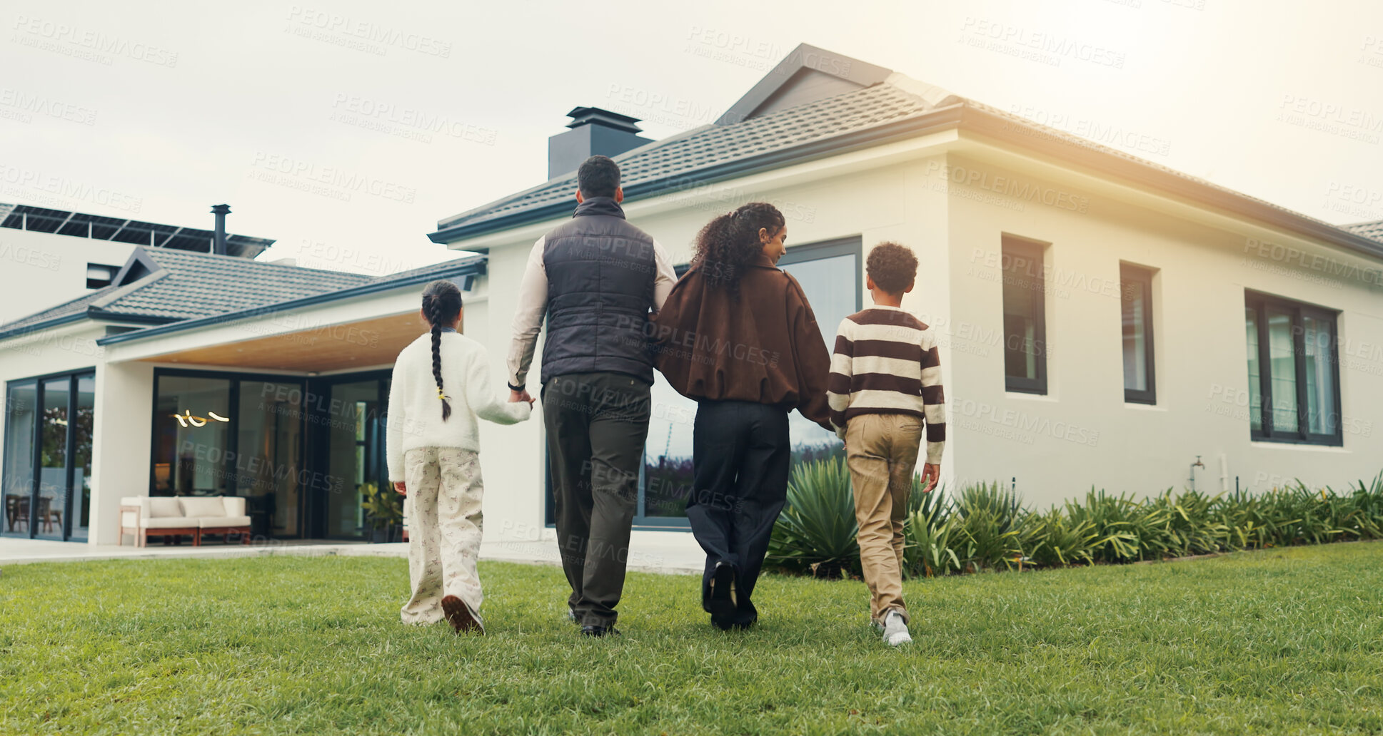 Buy stock photo Outdoor, walk and family holding hands by new home for fresh start, real estate investment and care. Children, mother and father with property, back and relocation to dream house with parents