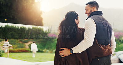 Buy stock photo Love, parents and hug for support at backyard, bonding and connection together with security. Mother, happy father and embrace with people outdoor for safety, smile and family unity with trust