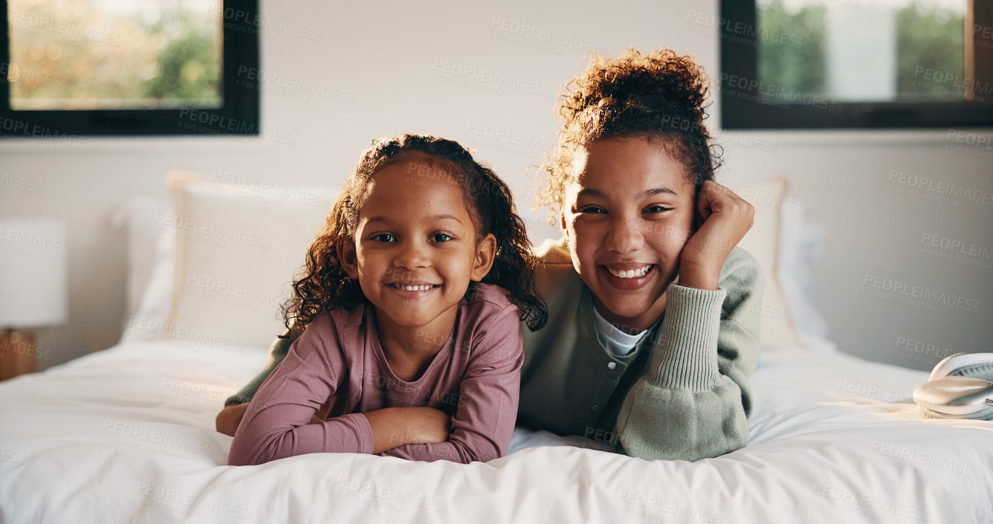 Buy stock photo Portrait, relax and smile of children on bed in home for holiday, morning break or weekend. Comfortable, cozy and sister with happy girls in bedroom of apartment for development, future or growth
