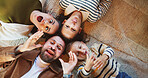Silly, parents or kids on floor with portrait, connection or happiness with family time. Above, playful or children in house with funny faces, solidarity or bonding together in healthy relationship.