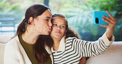 Buy stock photo Child, selfie or kiss with mom in home for bonding, memory or capture moment together. Mother, kid or daughter with smile, love or social media post for photography app, picture or affection in house