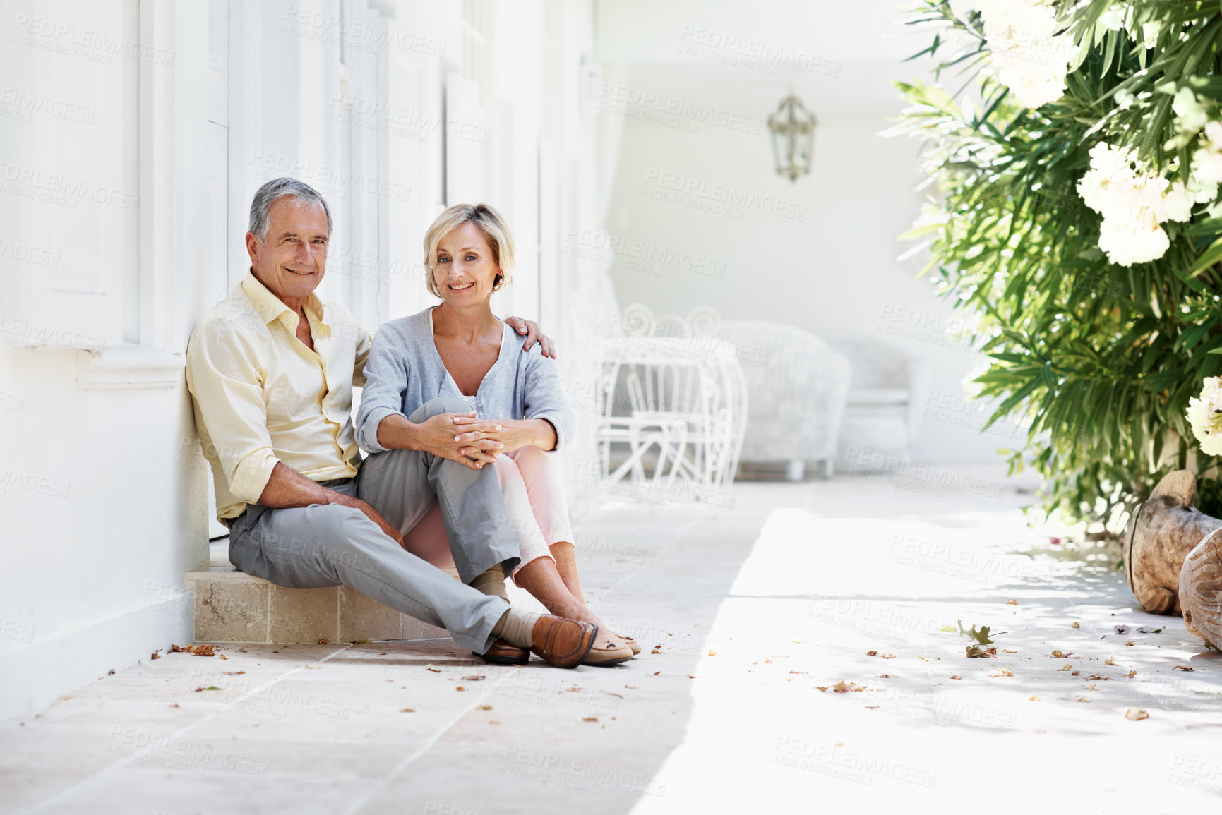 Buy stock photo Portrait, old couple and smile at resort for travel, love and bonding together for summer holiday. Happy, senior people and embrace on step for fresh air, partner affection and commitment on vacation