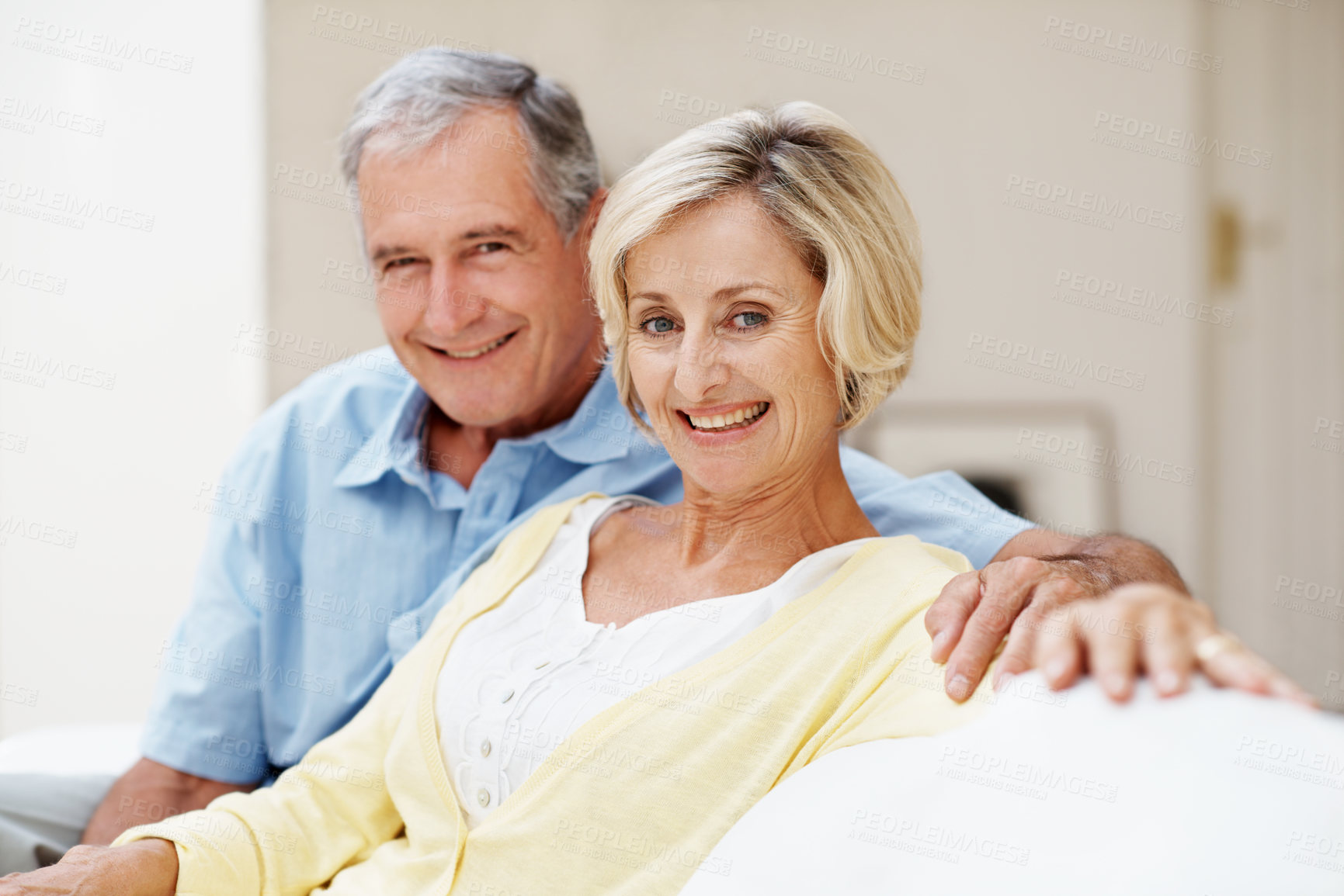 Buy stock photo Smile, love and portrait with old couple on sofa for bonding, connection and marriage. Retirement, happy and commitment with senior man and woman in living room in house for relax, trust and care