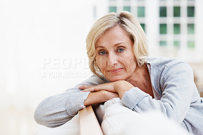Buy stock photo An attractive senior woman relaxing at home 
