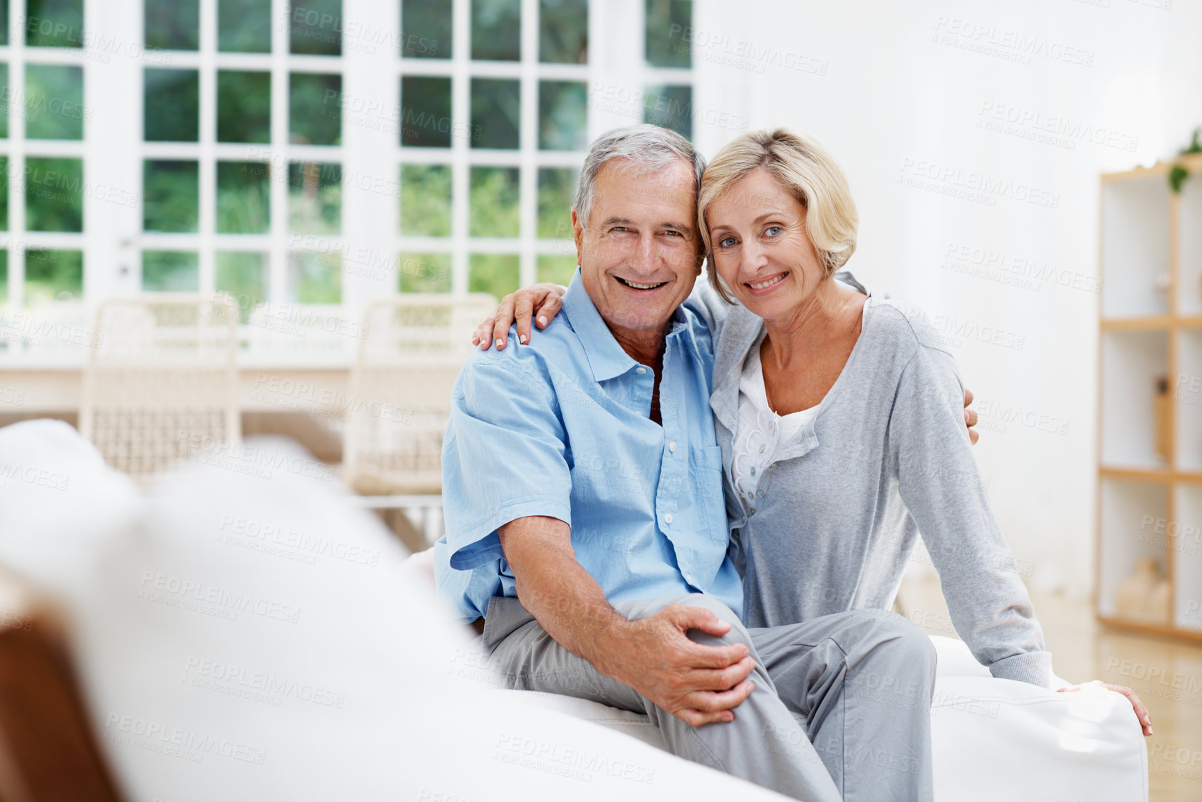 Buy stock photo Portrait, hug and relax with old couple on sofa in home for bonding, support or connection. Retirement, marriage commitment or love with senior man and woman in living room of house for weekend break