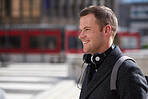 Young businessman smiling confident in city urban commuter going to work