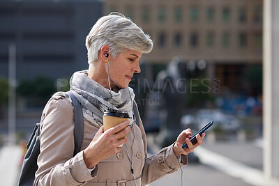 Buy stock photo Businesswoman, travel and texting with phone in city, reading and listen to financial podcast online. Streaming, audio and mature person with mobile on street, commuting and asset manager with coffee
