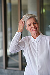 Portrait senior business woman smiling confident independent female in city wearing white shirt