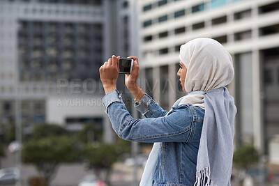 Buy stock photo Muslim woman, phone and picture in city, travel and capture memory for vacation adventure outdoor. Islamic person, mobile and photography in town for sightseeing, social media update and holiday post