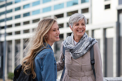 Buy stock photo Mother, travel and adult daughter in city with smile, bonding together and outdoor on weekend break. Happy, mature parent and women explore in urban town with family connection, wellness and support.