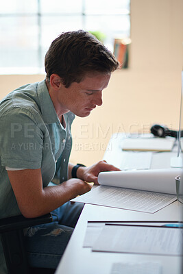 Buy stock photo Reading, student and man with document in home, course revision and learning for exam preparation. Education, studying and scholar with practice test for knowledge, college assignment or lesson notes